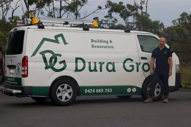 Dura Group van with building and renovation signage, Sydney. Mark Dura standing in front of Van