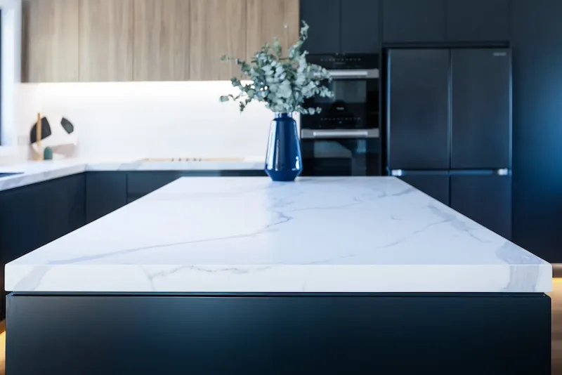 Discover the epitome of modern kitchen renovation with Dura Group's expertly crafted design seen in this image. Featuring a luxurious marble countertop that elevates aesthetics, this space embodies our commitment to quality and style. The sleek cabinetry and sophisticated finish highlight our expertise in kitchen upgrades and remodels. Dura Group, a Sydney-based, family-owned company, excels in designing kitchens that blend functionality with modern elegance. With over 27 years of construction experience, Managing Director Mark leads projects across Sutherland Shire, Bayside, and more. Our homeowner-first approach ensures trust, transparency, and personalized solutions for every home. Transform your kitchen into a space you love with our time-efficient, budget-friendly planning. Choose Dura Group for a seamless renovation journey that surpasses expectations. Contact us today to begin your kitchen transformation.
