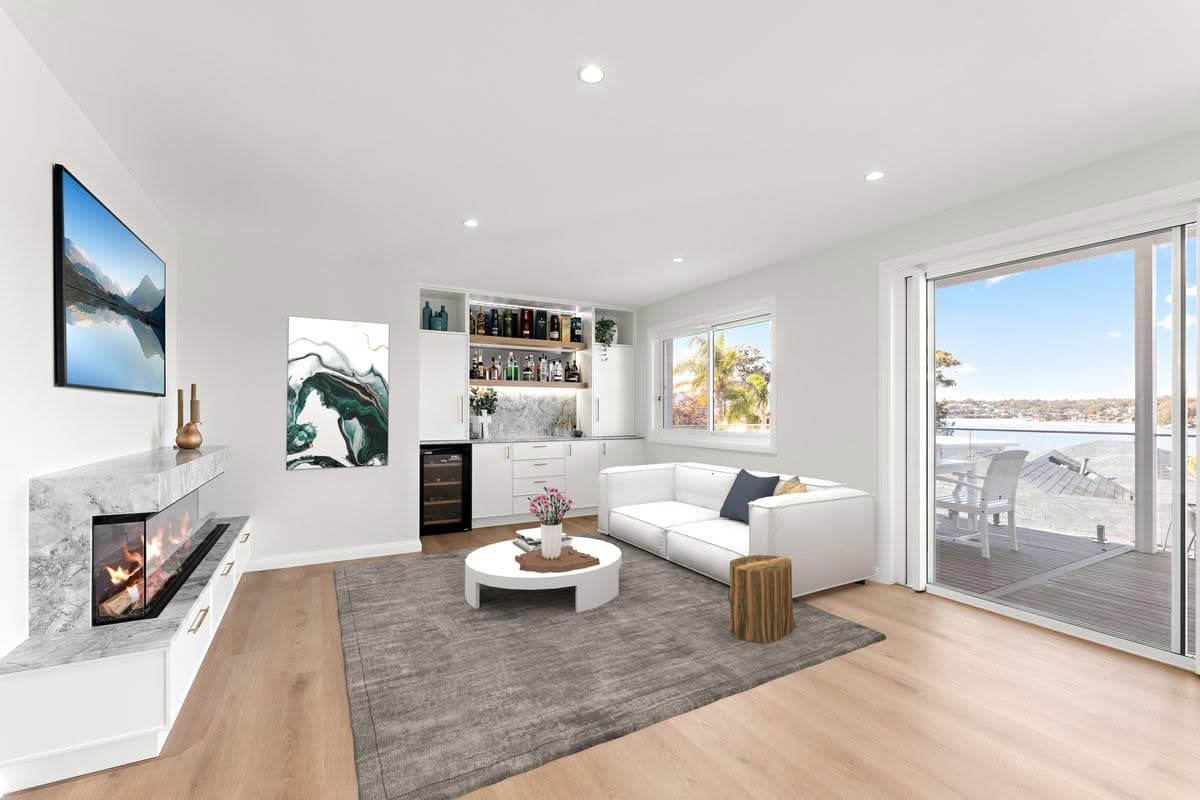 Living room renovation with marble fireplace and built-in bar