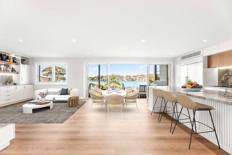 Stunning open plan living room with waterfront views dura group