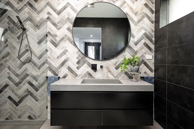 Modern bathroom remodel with herringbone tile