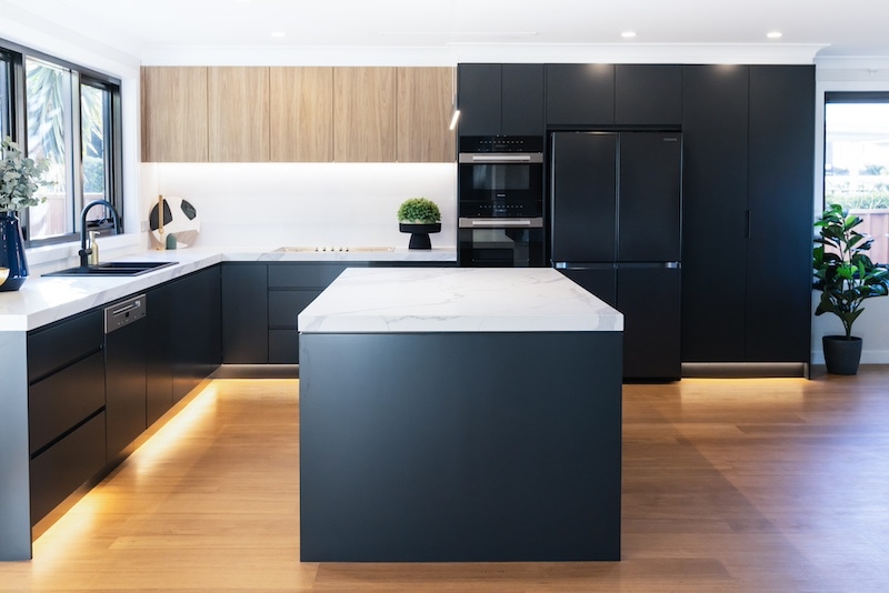 Explore a stunning modern kitchen remodel by Dura Group, Sydney's premier family-owned building company. Our expert team, led by Managing Director Mark with over 27 years of construction experience, delivers exceptional kitchen upgrades across the Sutherland Shire, Bayside, Inner West, Georges River, and Randwick regions. This kitchen features sleek cabinetry with a matte finish, elegant marble countertops, and state-of-the-art appliances, exemplifying our commitment to time efficiency and budget-conscious planning. At Dura Group, we prioritise trust, transparency, and communication, ensuring that your renovation project is completed without compromising on quality. Transform your kitchen into a luxurious space with a focus on functionality and style. Discover tailored building solutions that align with your lifestyle and preferences. Contact Dura Group today to begin your kitchen transformation journey and experience unparalleled craftsmanship and customer service.