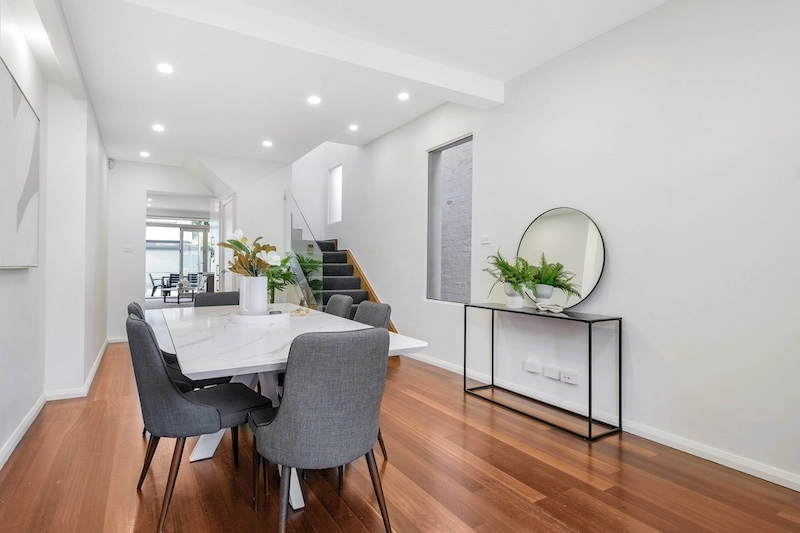 Experience a stunning transformation with our elegant dining room renovation, part of Dura Group's exceptional home improvement services. Located in Sydney, our family-owned company excels in creating beautiful, functional spaces with a homeowner-first approach. Our skilled team integrates modern design elements with a focus on time efficiency and budget-conscious planning. Specializing in home renovations across Sutherland Shire, Bayside, Inner West, Georges River, and Randwick, we ensure every project reflects quality craftsmanship and tailored building solutions. Picture your perfect dining area, complete with sleek, contemporary furniture and ambient lighting, all brought to life without compromising on your budget or timeline. Trust and transparency are at the core of Dura Group's values, ensuring you are always informed and engaged throughout the renovation process. Whether you’re looking for ground floor extensions or upper storey additions, our expertise spans kitchen upgrades to bathroom remodels. Contact Dura Group today to discuss your next project and turn your unique vision into reality. Let us transform your home elegantly and efficiently, delivering stunning results every time. Discover the Dura difference. Call us now to get started on your dream home renovation!