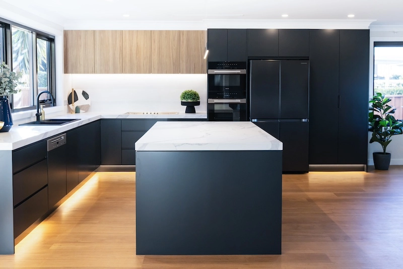 Explore a stunning modern kitchen remodel by Dura Group, Sydney's premier family-owned building company. Our expert team, led by Managing Director Mark with over 27 years of construction experience, delivers exceptional kitchen upgrades across the Sutherland Shire, Bayside, Inner West, Georges River, and Randwick regions. This kitchen features sleek cabinetry with a matte finish, elegant marble countertops, and state-of-the-art appliances, exemplifying our commitment to time efficiency and budget-conscious planning. At Dura Group, we prioritise trust, transparency, and communication, ensuring that your renovation project is completed without compromising on quality. Transform your kitchen into a luxurious space with a focus on functionality and style. Discover tailored building solutions that align with your lifestyle and preferences. Contact Dura Group today to begin your kitchen transformation journey and experience unparalleled craftsmanship and customer service.